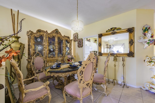 dining room with baseboards and tile patterned floors