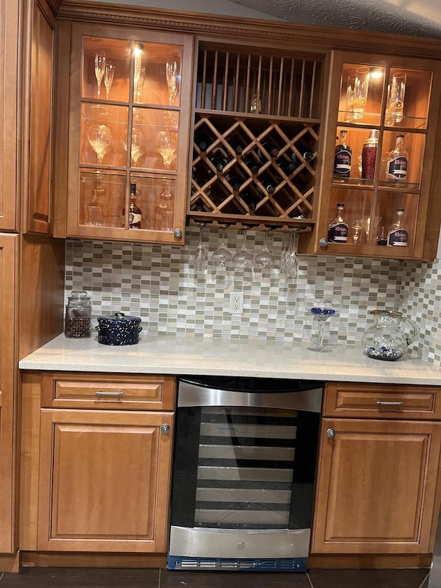 bar featuring a dry bar, beverage cooler, and decorative backsplash