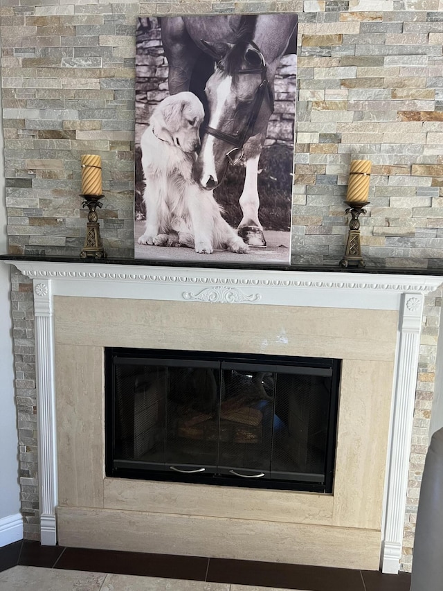 interior details featuring a glass covered fireplace