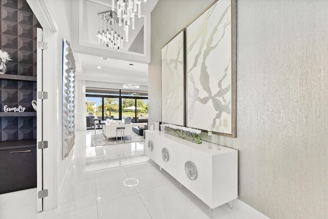 foyer entrance with an inviting chandelier and tile patterned floors