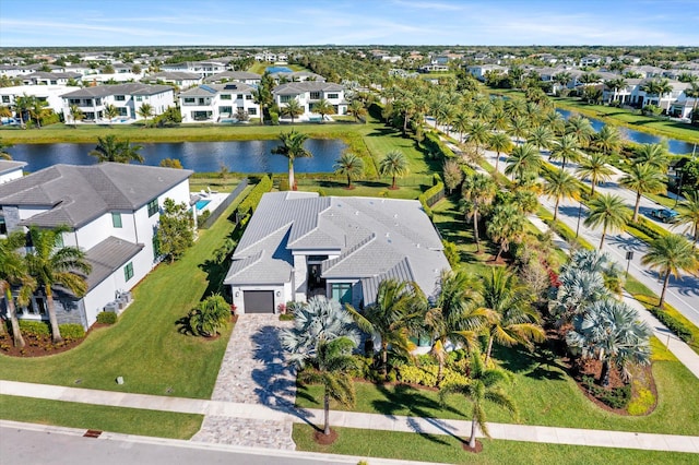 birds eye view of property with a residential view and a water view