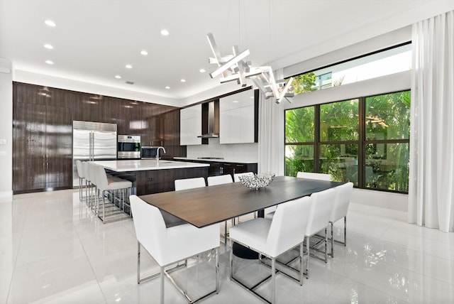 dining room with light tile patterned flooring and recessed lighting