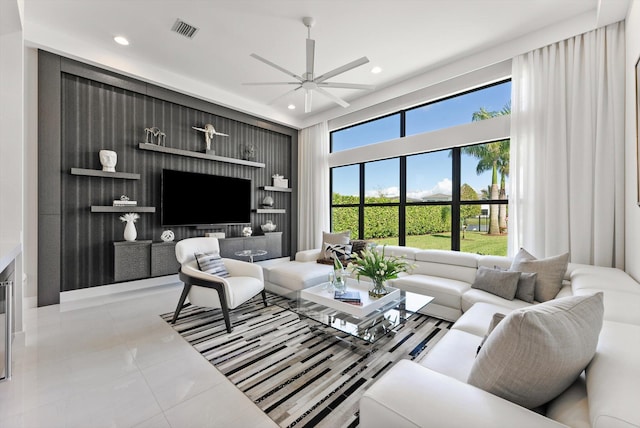 living room featuring ceiling fan, light tile patterned floors, visible vents, and recessed lighting