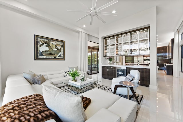 living room with recessed lighting, beverage cooler, and bar area