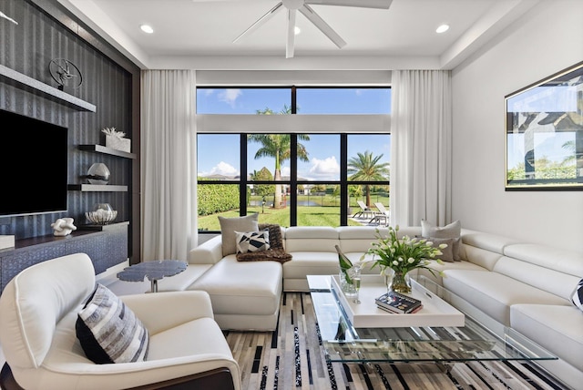 living area with ceiling fan, wood finished floors, and recessed lighting