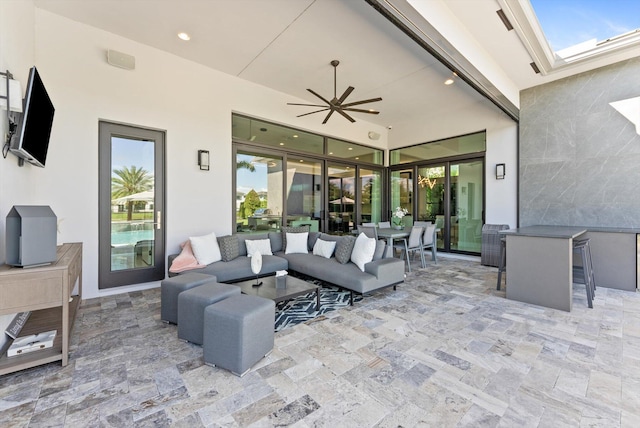 view of patio / terrace with a ceiling fan and an outdoor hangout area