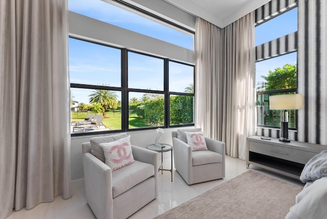 sitting room with tile patterned flooring and a wealth of natural light