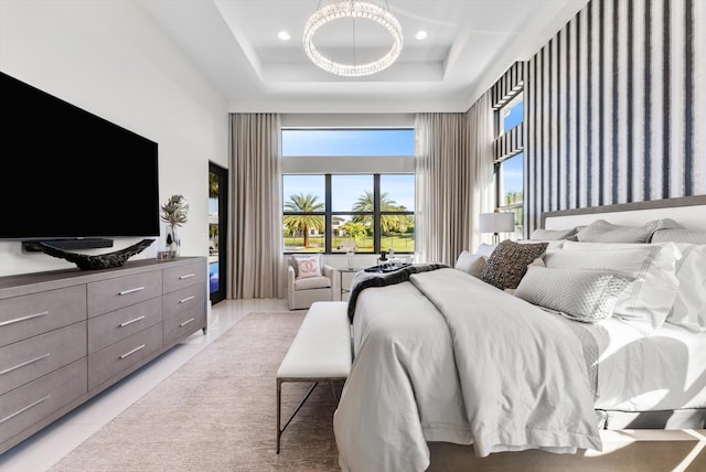 bedroom featuring light tile patterned floors, a high ceiling, a raised ceiling, and recessed lighting