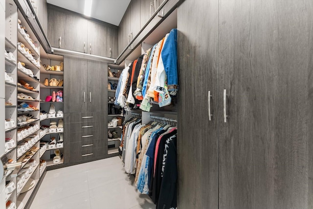 walk in closet featuring tile patterned flooring