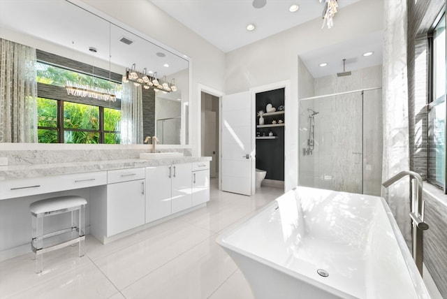 full bath with recessed lighting, a soaking tub, visible vents, a stall shower, and vanity