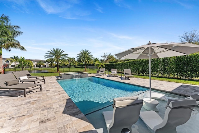 view of swimming pool with a patio area, a fenced backyard, and a pool with connected hot tub