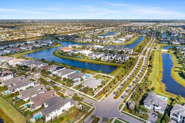 bird's eye view with a water view and a residential view