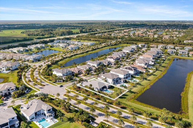 aerial view featuring a water view and a residential view