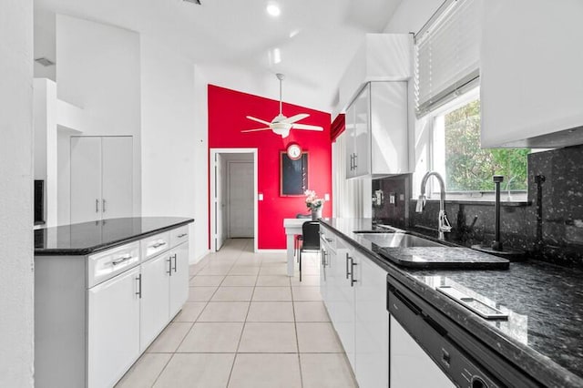 kitchen with backsplash, white cabinetry, a sink, light tile patterned flooring, and dishwasher