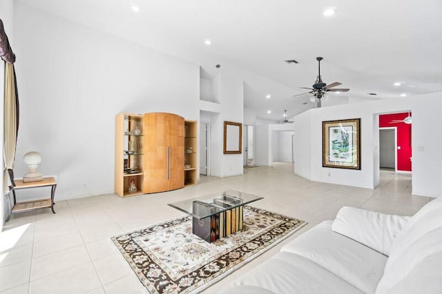 living area featuring tile patterned flooring, ceiling fan, and recessed lighting