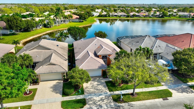 bird's eye view with a residential view and a water view