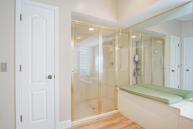 4408 Gator Trace Ln, Fort Pierce, FL 34982 - bathroom with a stall shower, wood finished floors, and recessed lighting