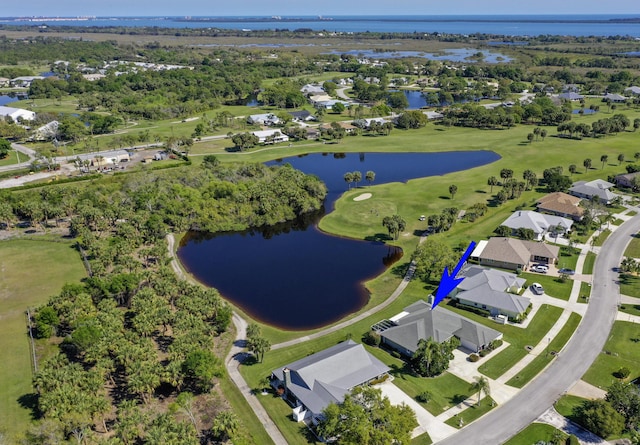 drone / aerial view featuring a water view, a residential view, and golf course view