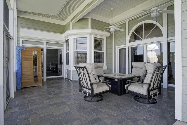 view of patio / terrace featuring ceiling fan