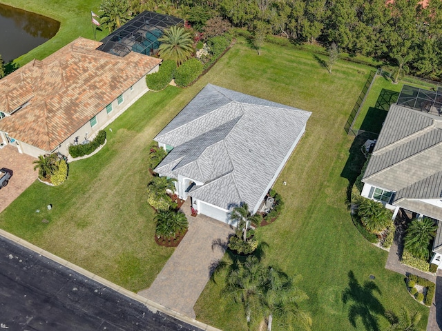 birds eye view of property with a water view