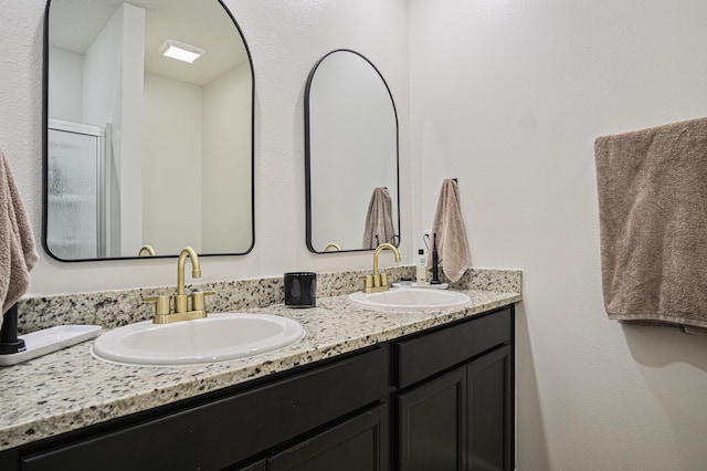 bathroom with double vanity and a sink