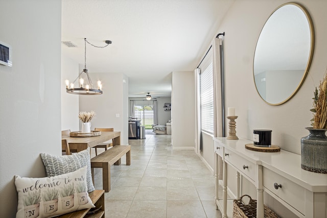 dining room featuring a chandelier, recessed lighting, visible vents, and baseboards