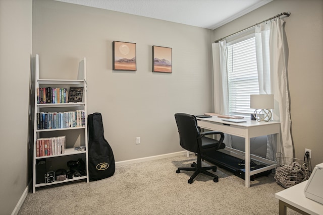 home office featuring carpet and baseboards