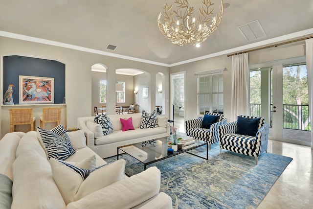 living room with arched walkways, ornamental molding, visible vents, and an inviting chandelier