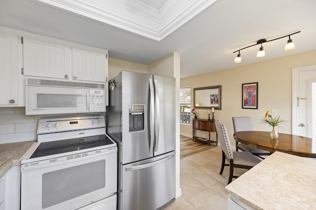 kitchen with light countertops, white appliances, backsplash, and white cabinets