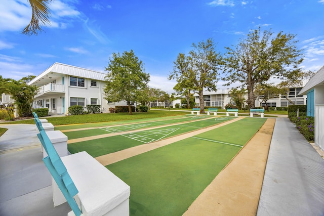 view of home's community featuring shuffleboard