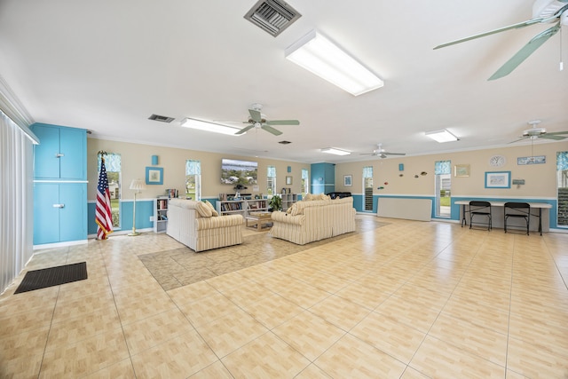 living area featuring a healthy amount of sunlight, visible vents, and tile patterned floors