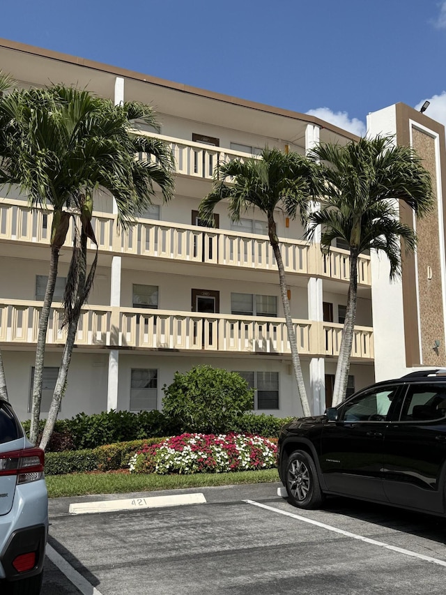 4062 Guildford D, Boca Raton, FL 33434 - view of building exterior featuring uncovered parking
