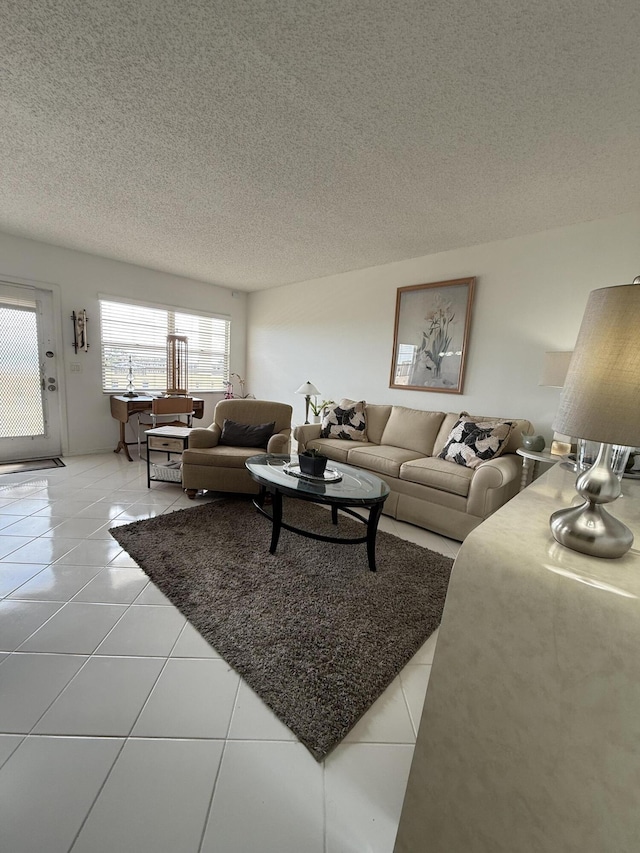 4062 Guildford D, Boca Raton, FL 33434 - living area featuring a textured ceiling and light tile patterned floors