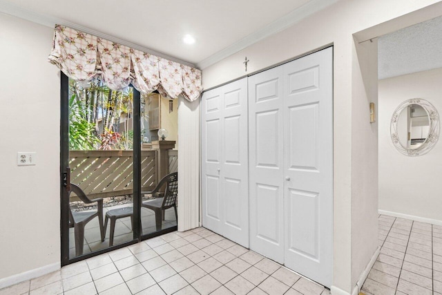 unfurnished dining area with crown molding, light tile patterned flooring, and baseboards