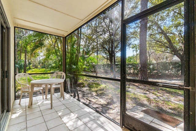 unfurnished sunroom featuring a healthy amount of sunlight