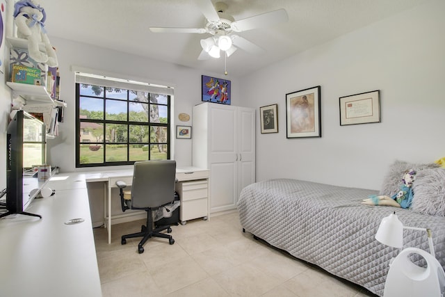 bedroom featuring light tile patterned flooring and a ceiling fan