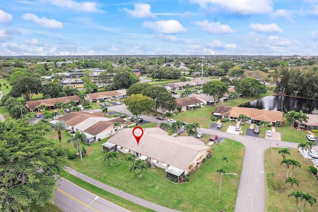 bird's eye view with a water view and a residential view