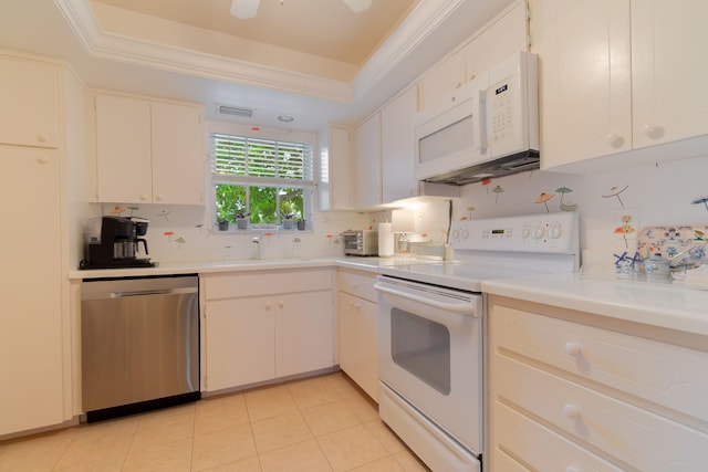 kitchen featuring light countertops, white appliances, visible vents, and crown molding