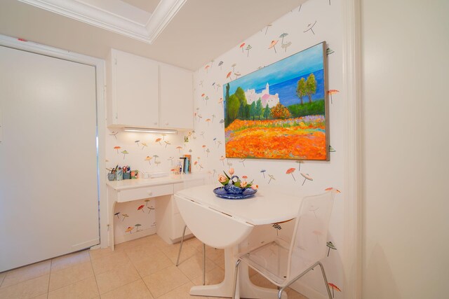 kitchen featuring light tile patterned floors, a toaster, white appliances, light countertops, and ornamental molding