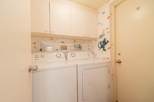 laundry room with cabinet space and washer and dryer