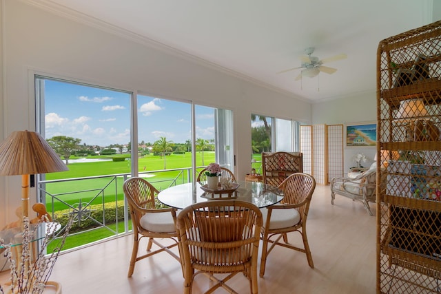 sunroom featuring ceiling fan