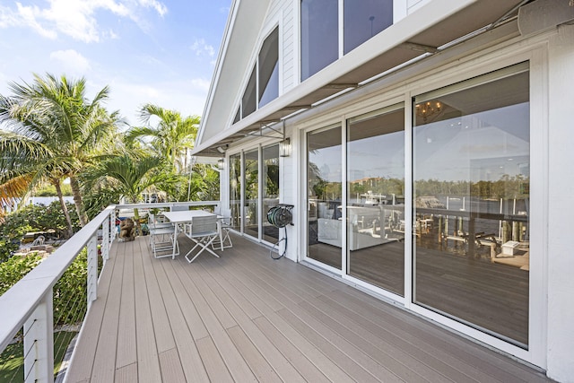 wooden terrace featuring outdoor dining space