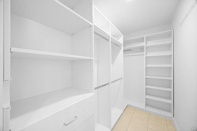 walk in closet featuring light tile patterned floors