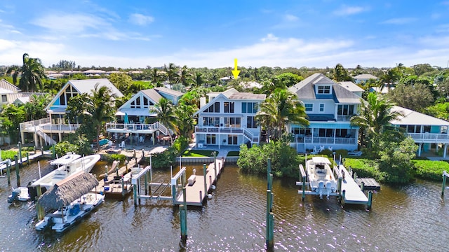 bird's eye view featuring a water view and a residential view