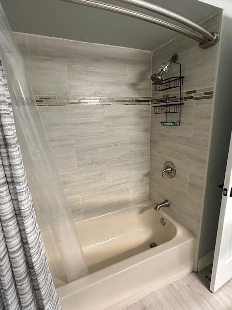 full bathroom featuring shower / tub combo with curtain