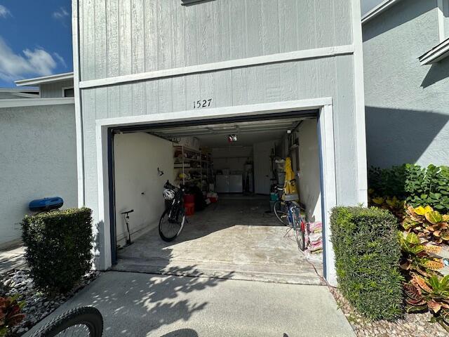 garage with concrete driveway