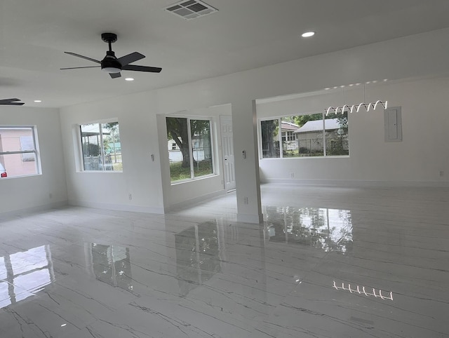 unfurnished room with recessed lighting, a ceiling fan, visible vents, baseboards, and marble finish floor