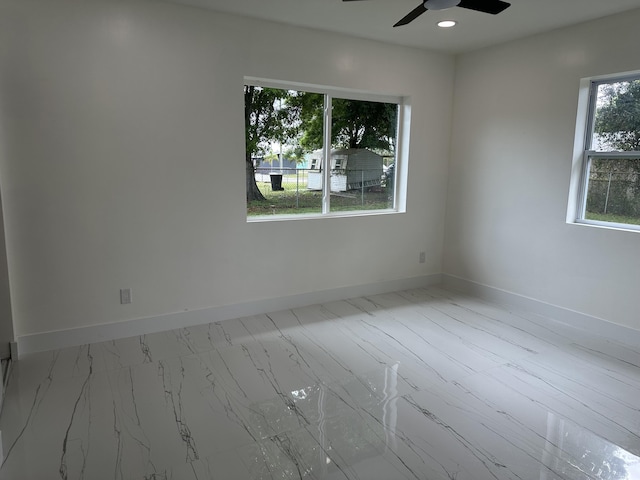 unfurnished room with a ceiling fan, recessed lighting, and baseboards