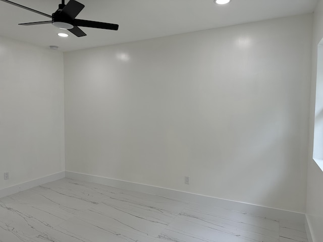 spare room with recessed lighting, a ceiling fan, and baseboards