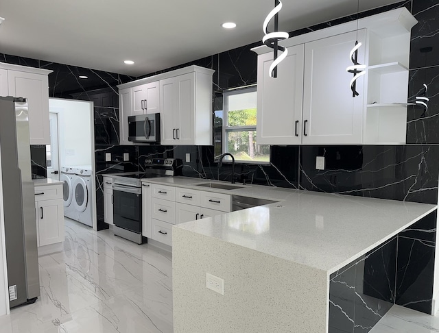 kitchen featuring stainless steel appliances, a sink, marble finish floor, independent washer and dryer, and open shelves